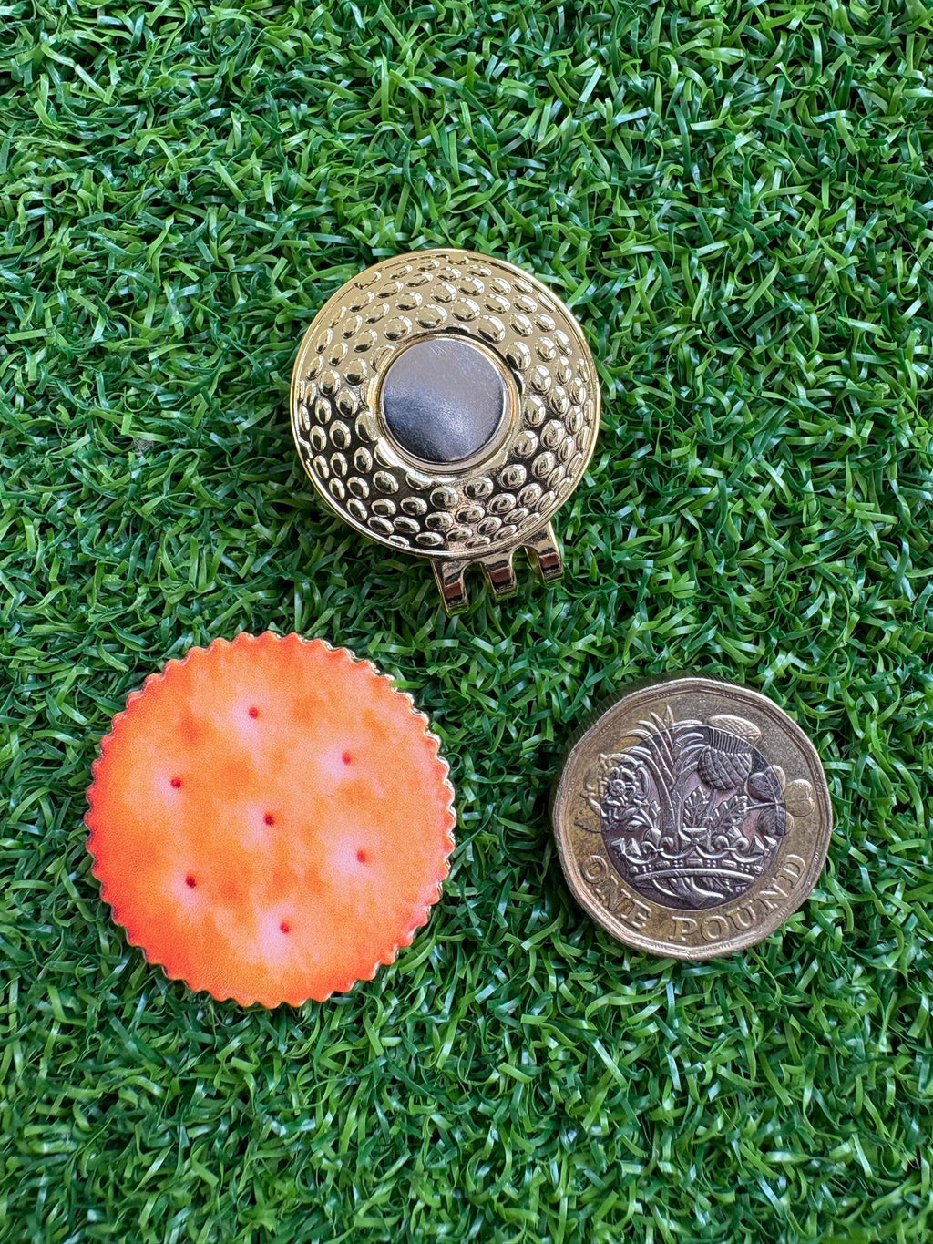 Unique cracker/biscuit golf ball marker with magnetic hat clip