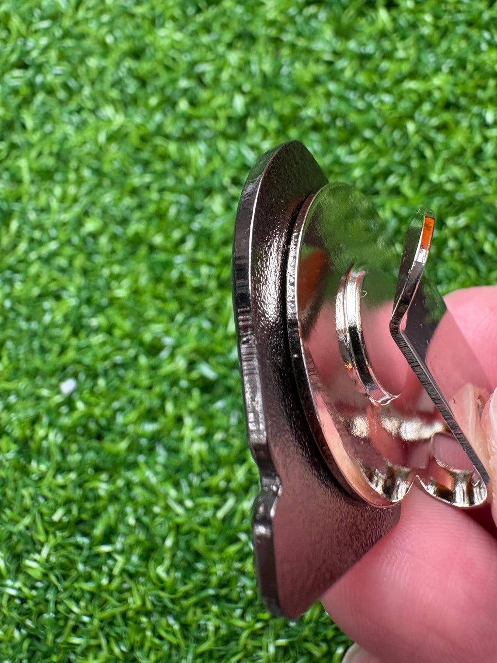 Cartoon-style golf ball marker